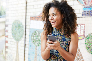 Woman using her cell phone at night